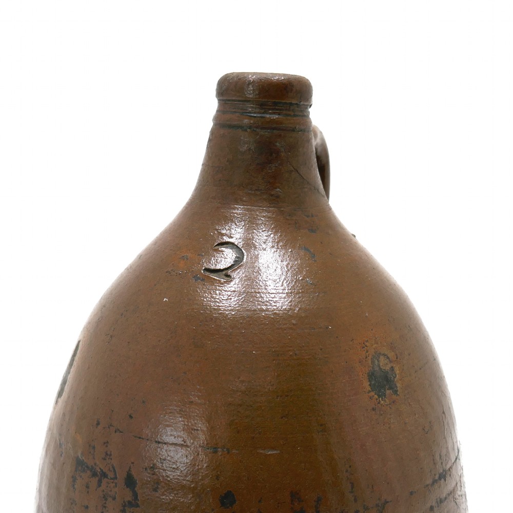 An 18th-century salt-glazed brown stoneware flagon featuring a bulbous body, narrow neck, loop handle, and an impressed number two on the shoulder. View II