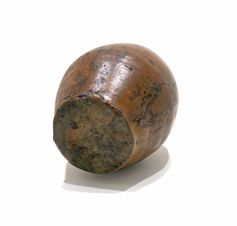 An 18th-century salt-glazed brown stoneware flagon featuring a bulbous body, narrow neck, loop handle, and an impressed number two on the shoulder. View IV