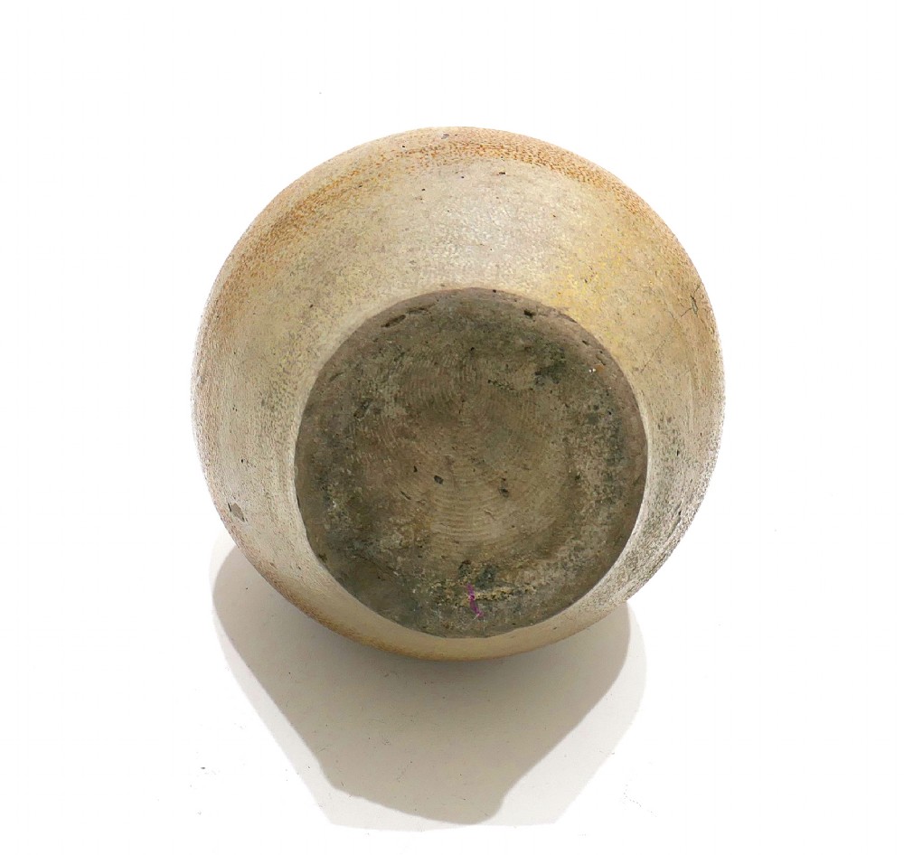 A 17th-century bulbous brown salt-glazed stoneware Bellarmine jug featuring a relief-carved bearded mask on the neck and decorative rosette medallions. View V