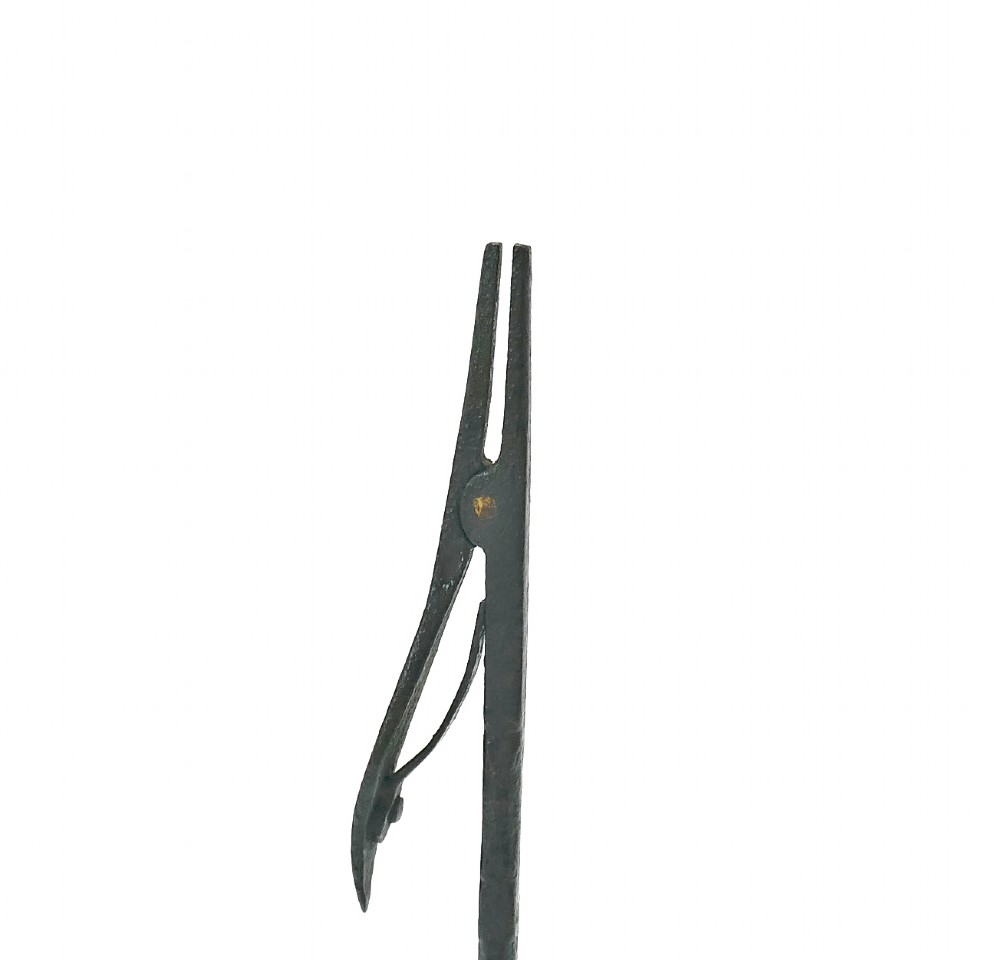 An eighteenth-century hand-forged wrought iron rushlight holder with a spring-action clamp and a tripod base. View III