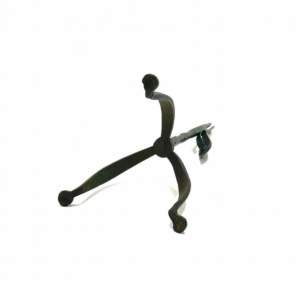 An eighteenth-century hand-forged wrought iron rushlight holder with a spring-action clamp and a tripod base. View IV