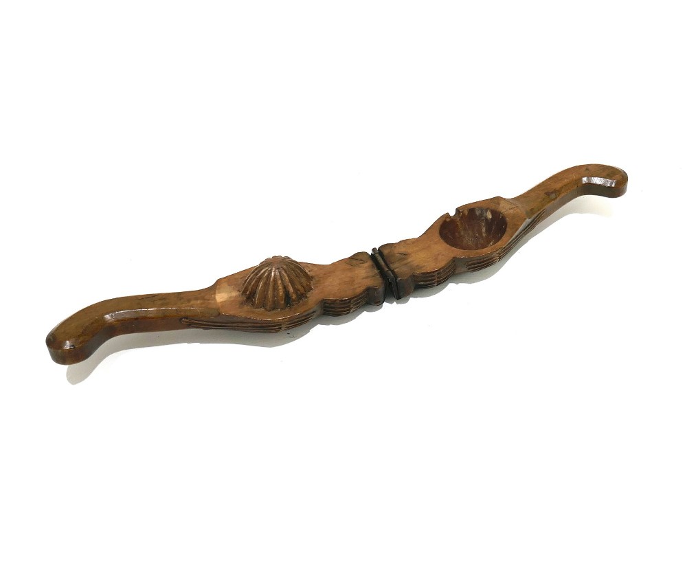 A 19th-century carved sycamore lemon squeezer shaped as two falcon heads with a hinged top and dark wood patina. View IV