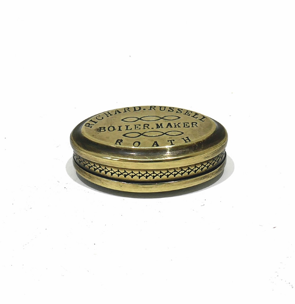 An oval antique brass snuff box with engraved lettering reading Richard Russell Boiler Maker Roath. View III