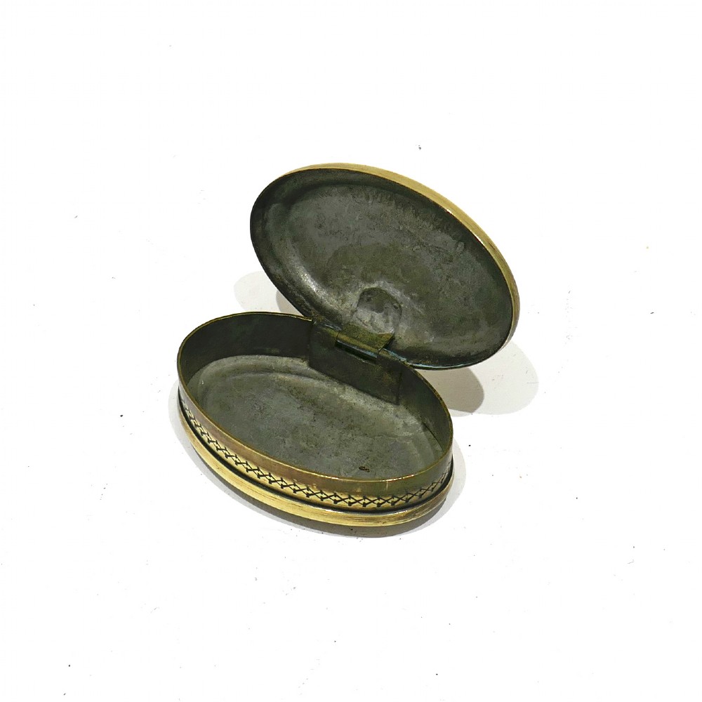An oval antique brass snuff box with engraved lettering reading Richard Russell Boiler Maker Roath. View VI