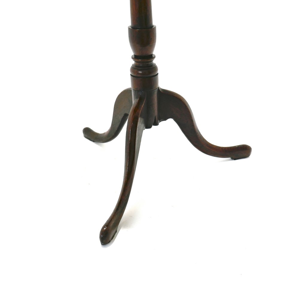 An 18th-century dark oak tripod table featuring a circular top, a slender turned central column stem, and three curved splayed legs. View III