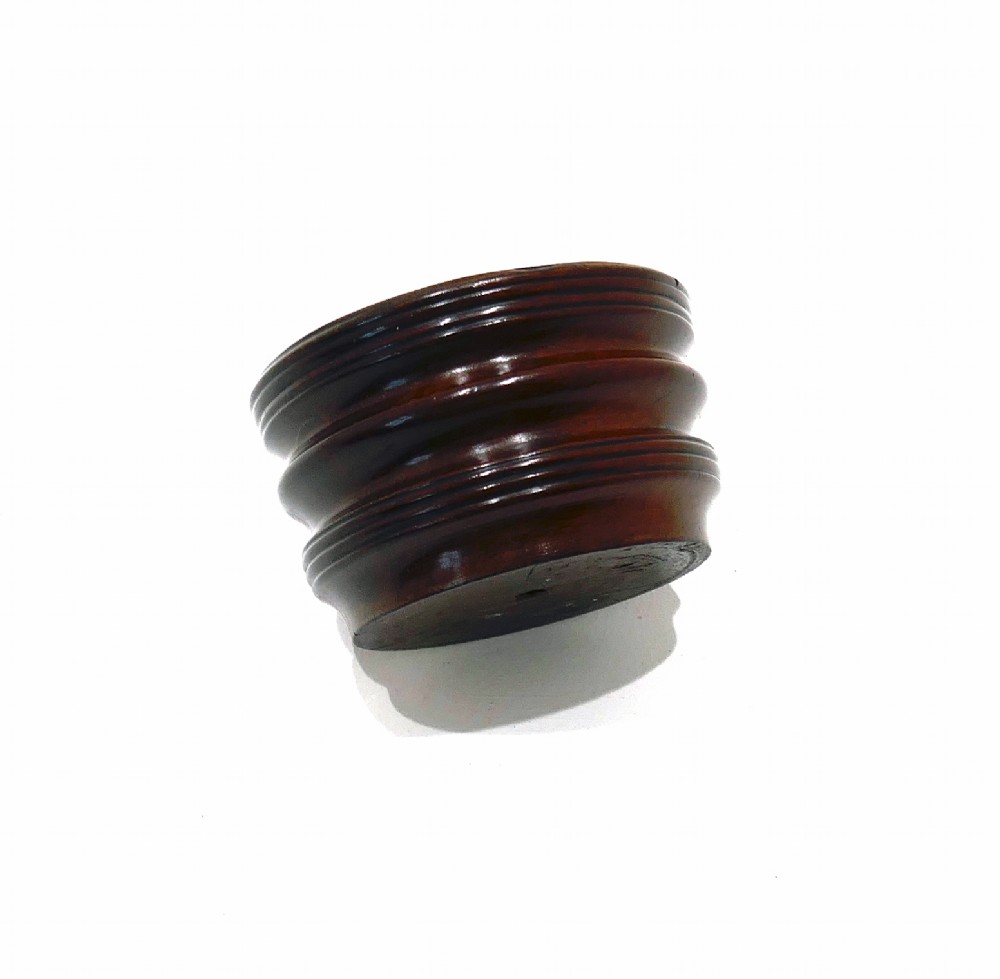 An antique late 18th-century turned laburnum wood open salt cellar featuring a ribbed exterior and a rich dark brown polished finish. View III