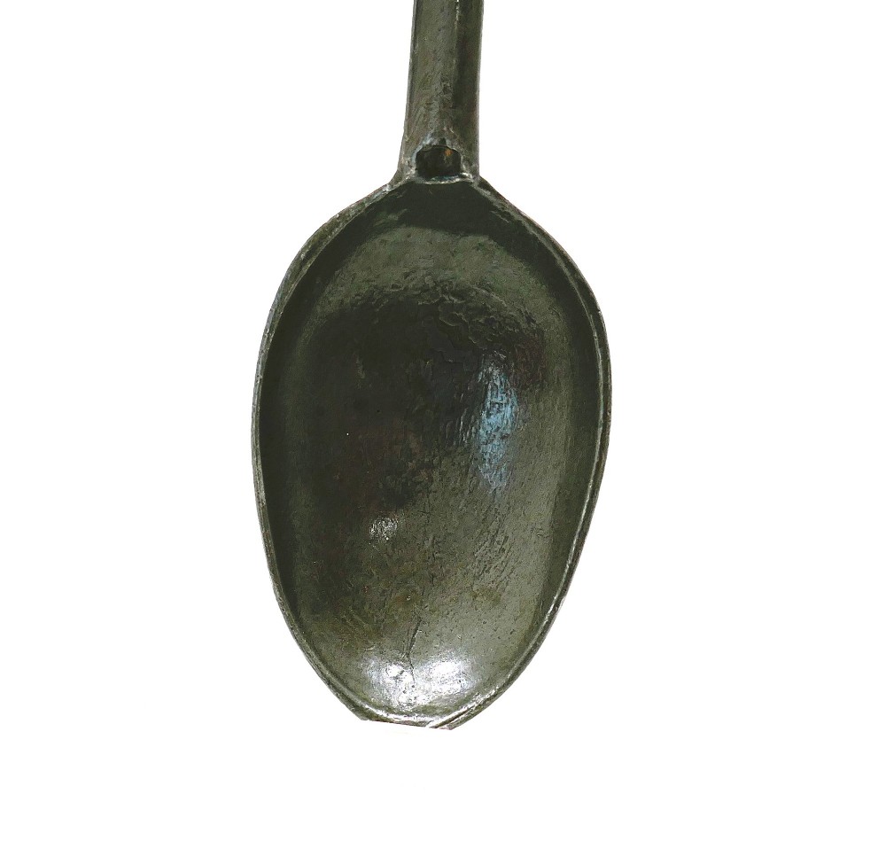 An eighteenth-century English pewter dognose spoon featuring an elongated oval bowl and an oxidised grey finish. View II
