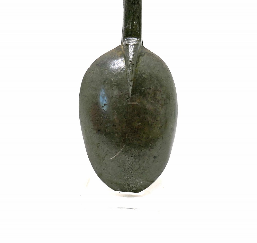 An eighteenth-century English pewter dognose spoon featuring an elongated oval bowl and an oxidised grey finish. View IV