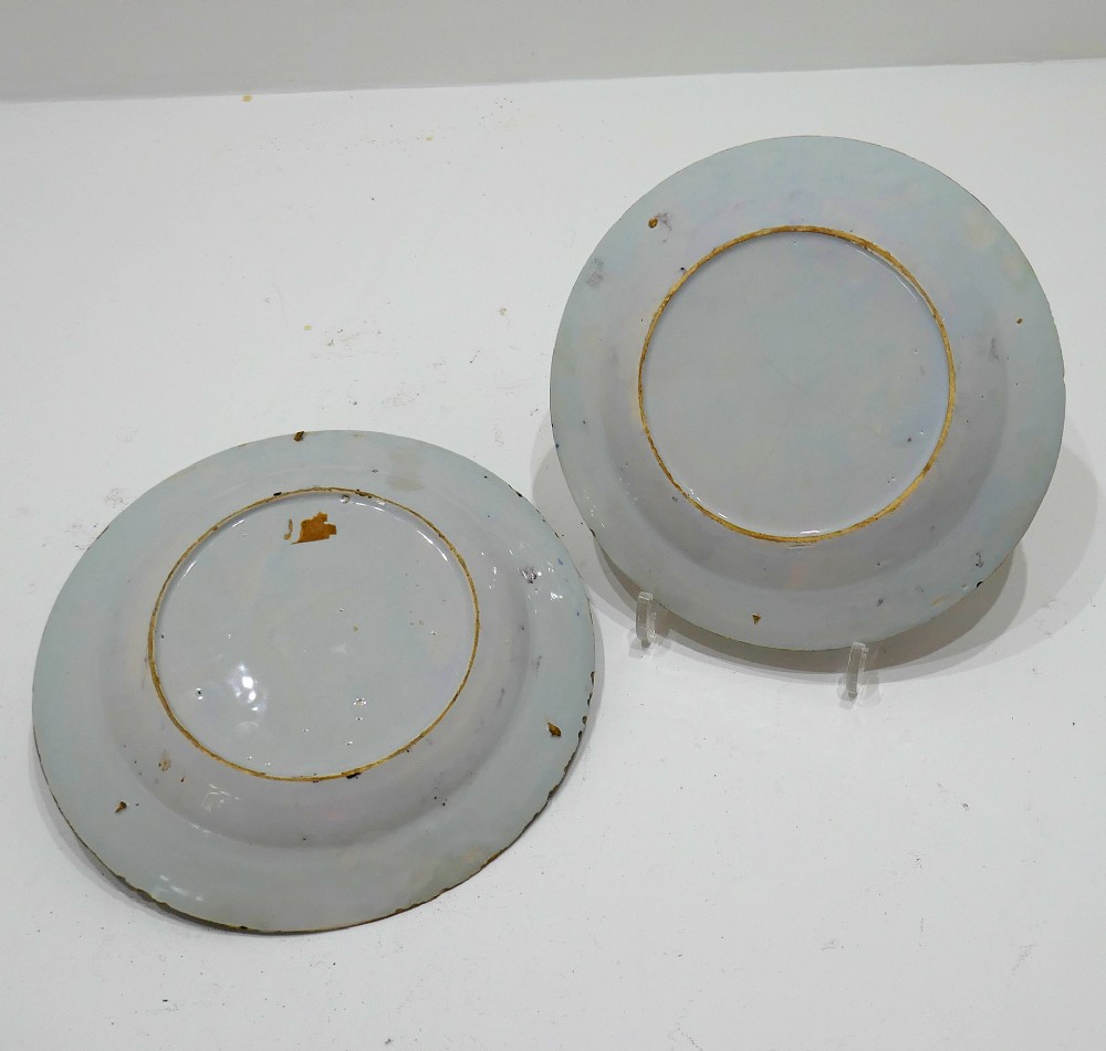 A pair of 18th-century circular tin-glazed earthenware plates decorated with hand-painted polychrome chinoiserie figures and floral rim borders. View IV