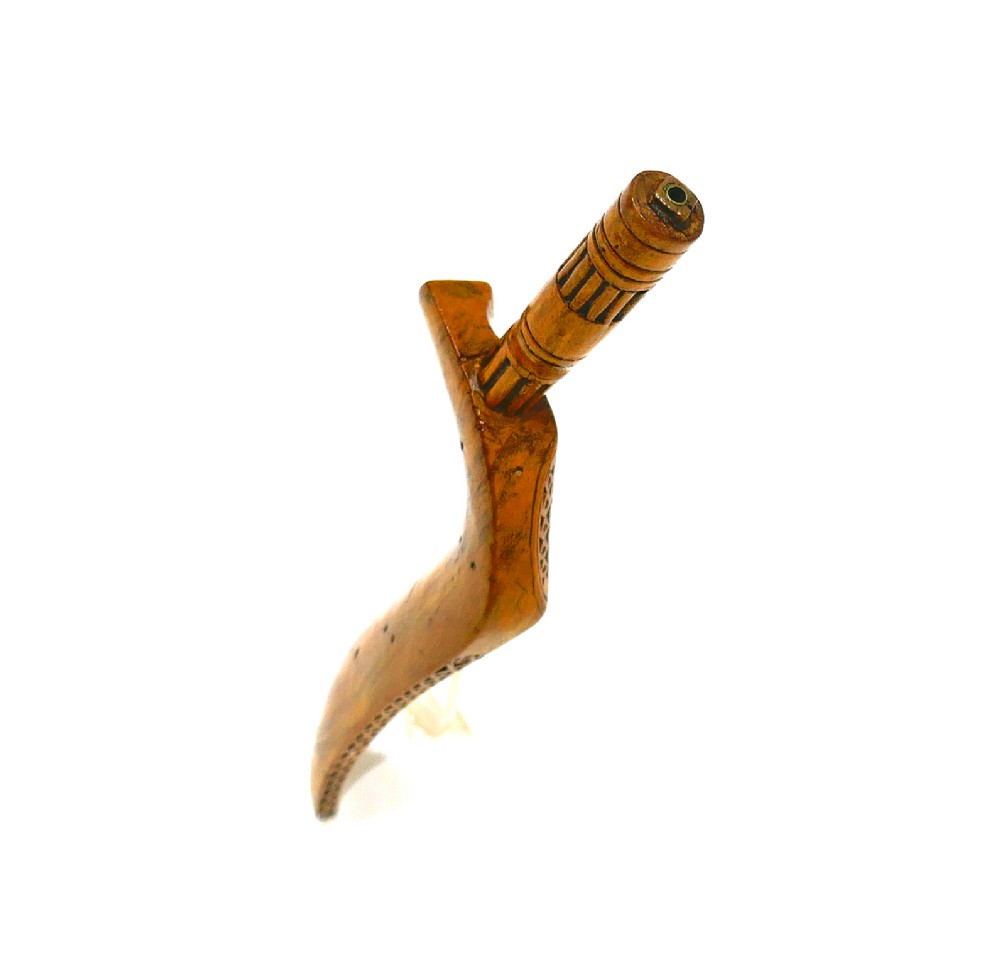 A 19th-century Cumbrian fruitwood goosewing knitting sheath featuring intricate chip-carved and punchwork geometric decoration alongside a turned terminal. View IV