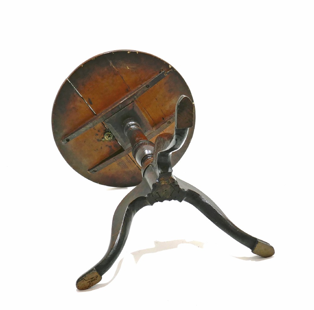 An 18th-century English Georgian tripod table featuring a circular tilt top supported by a turned baluster stem and three curved cabriole legs. View VI