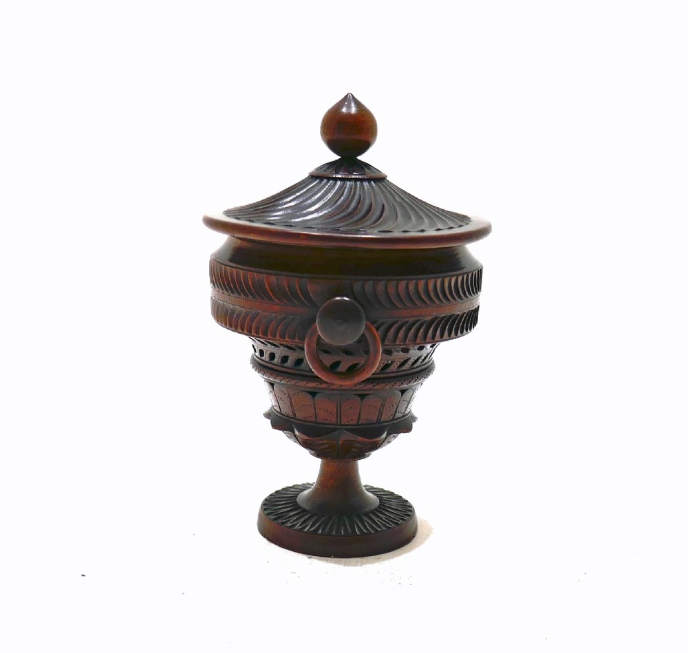 An early 19th-century turned fruitwood lidded pomander cup featuring a finial top, spiralled fluting, carved ring handles, and a pedestal base. View II