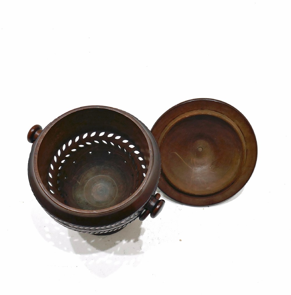 An early 19th-century turned fruitwood lidded pomander cup featuring a finial top, spiralled fluting, carved ring handles, and a pedestal base. View V