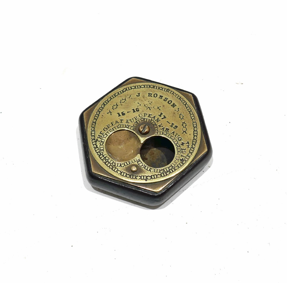 An early twentieth-century hexagonal brass miser snuff box with engraved text including J Robson and The Great European War Aug 4th 1914. View II