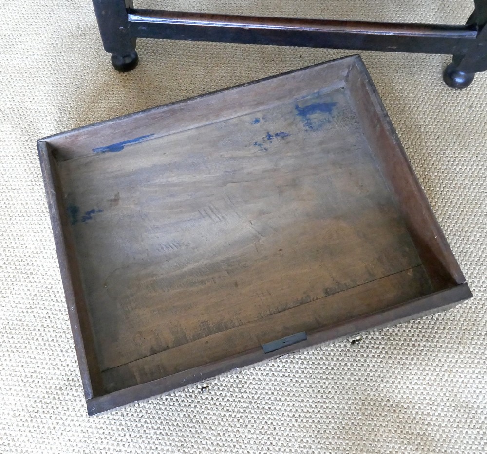 A 17th-century English oak side table featuring a single drawer with brass drop handles, turned ball legs, and a perimeter stretcher base. View IV