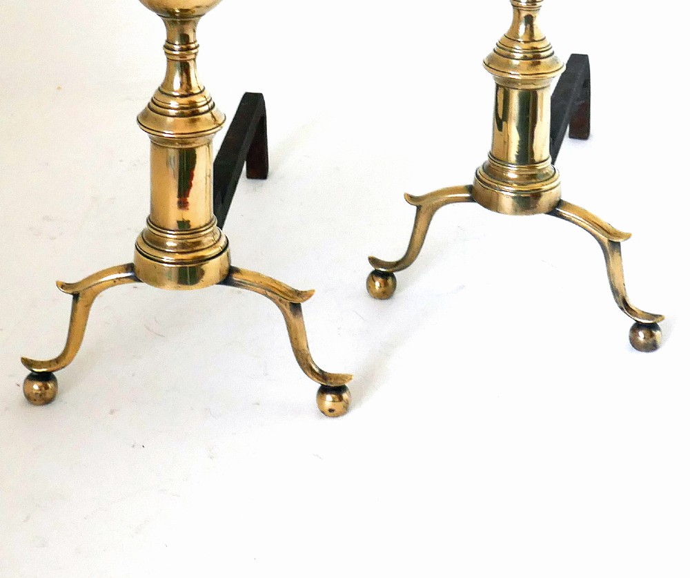 A pair of late eighteenth-century brass and irons featuring turned urn finials, spurred legs, and ball feet attached to wrought iron billets. View II