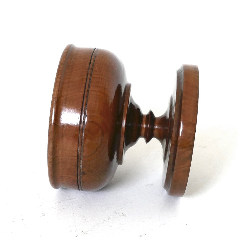 An 18th-century turned yew wood salt cellar featuring a bowl-shaped top set on a short pedestal stem and circular stepped base. View IV