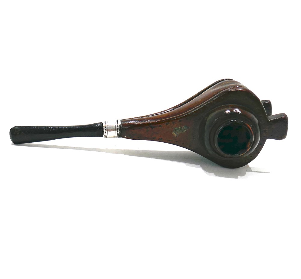 A nineteenth-century carved fruitwood tobacco pipe shaped like miniature fireplace bellows with an ebonised stem and metal ferrule band. View III