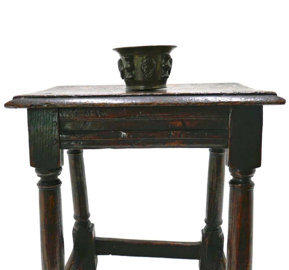 A 17th-century Commonwealth joined oak stool featuring turned legs, pegged mortise joints, lower stretchers, and a moulded rectangular seat. View II