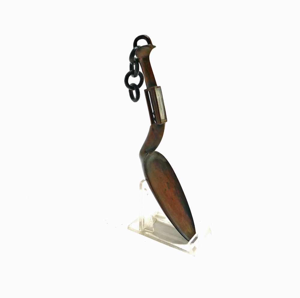 A carved fruitwood Welsh love spoon featuring an oval bowl, a framed name panel inscribed Ann Jones along the handle, and carved wooden chain links at the terminal. View V