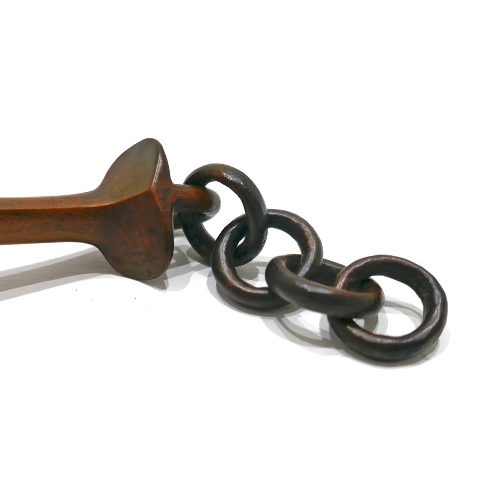 A carved fruitwood Welsh love spoon featuring an oval bowl, a framed name panel inscribed Ann Jones along the handle, and carved wooden chain links at the terminal. View VI