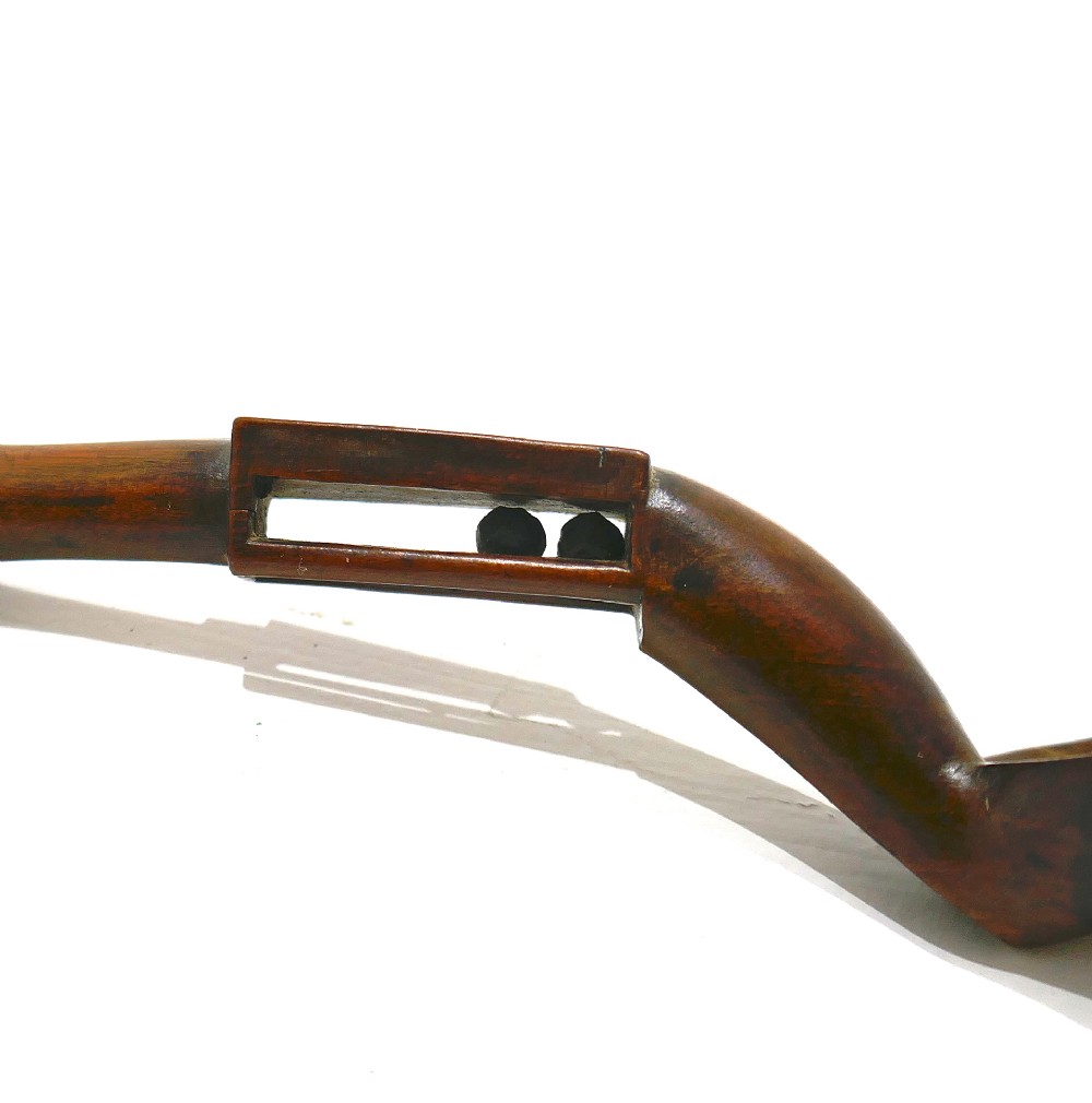 A carved fruitwood Welsh love spoon featuring an oval bowl, a framed name panel inscribed Ann Jones along the handle, and carved wooden chain links at the terminal. View VII