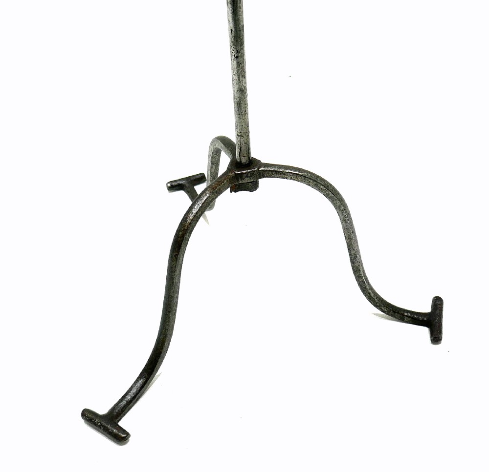An eighteenth-century wrought iron adjustable lark spit toaster featuring a tripod base with rolled feet, a central vertical stem, and six pointed prongs. View II