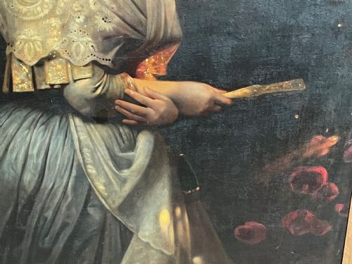 fig 5. A nineteenth-century oil painting on canvas depicting a smiling woman in a lace shawl holding a fan against a dark background.