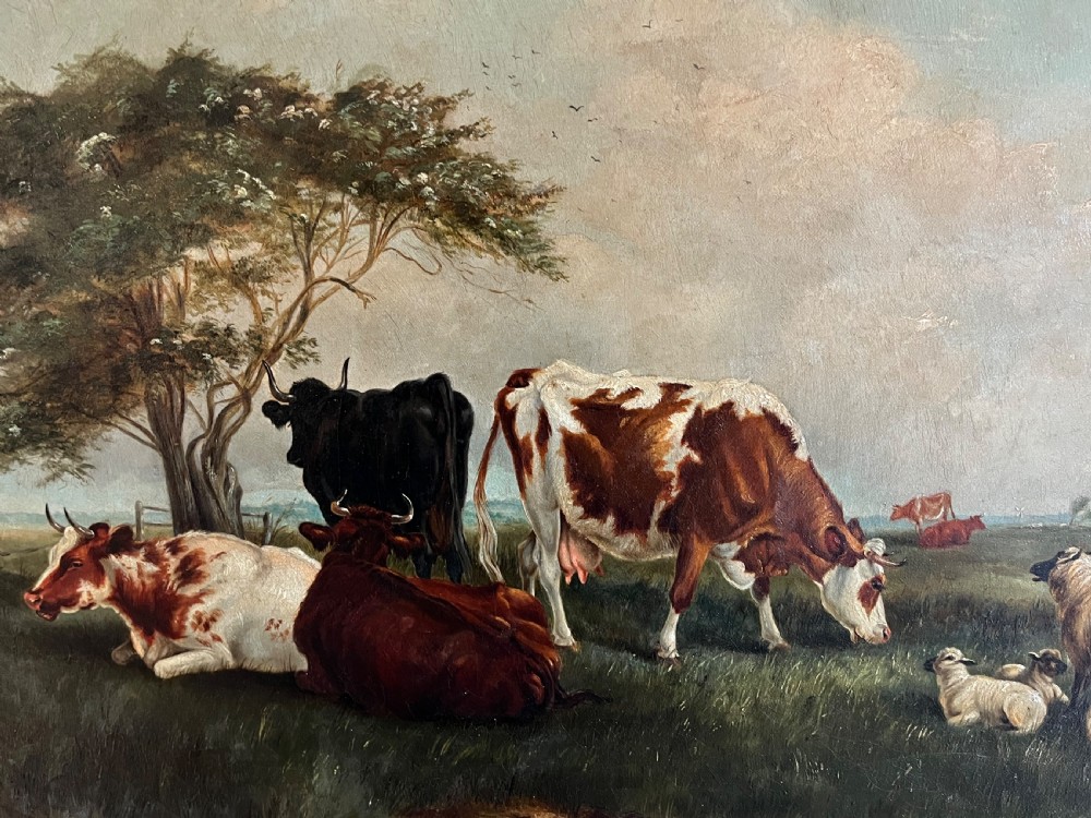 A Victorian oil painting on canvas depicting cattle and sheep resting in a field, presented within an ornate carved gilt moulding frame. View II