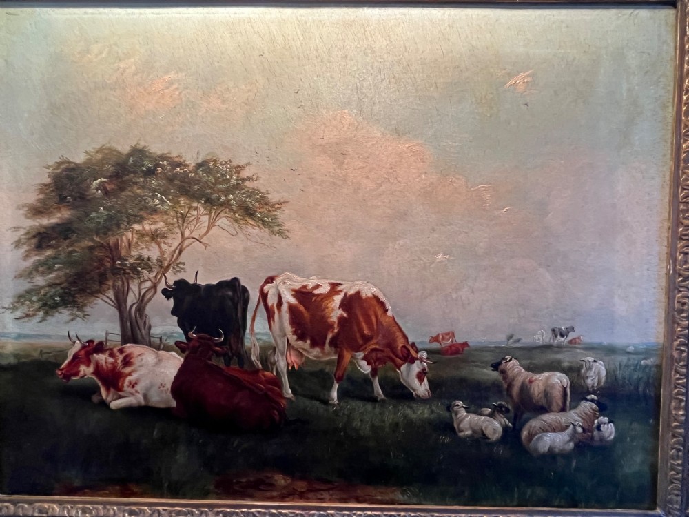 A Victorian oil painting on canvas depicting cattle and sheep resting in a field, presented within an ornate carved gilt moulding frame. View III
