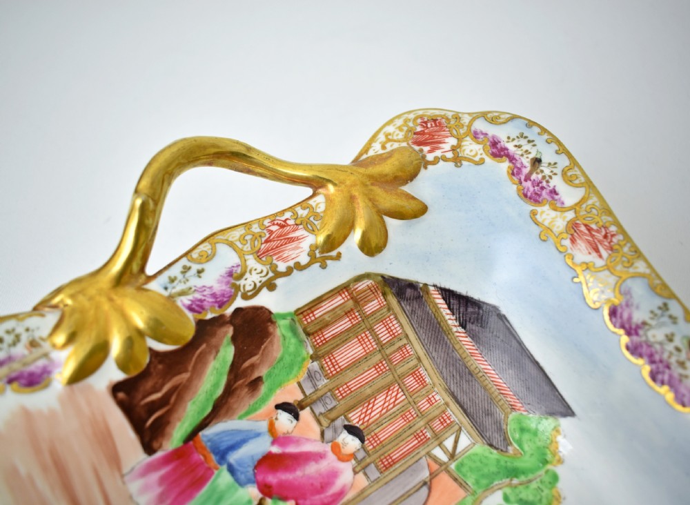 A Regency-era rectangular Swansea porcelain comport featuring gilded twin handles, a shaped border, and a polychrome hand-painted Mandarin Chinoiserie landscape scene. View VII