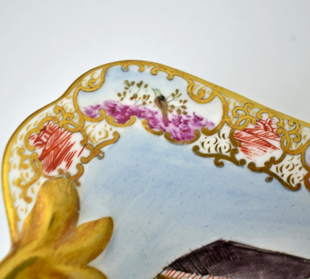 A Regency-era rectangular Swansea porcelain comport featuring gilded twin handles, a shaped border, and a polychrome hand-painted Mandarin Chinoiserie landscape scene. View VIII