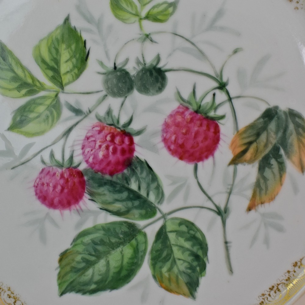 A set of four circular Russian porcelain plates decorated with hand-painted botanical fruit motifs, blush pink borders, and scalloped gilded rims. View VII