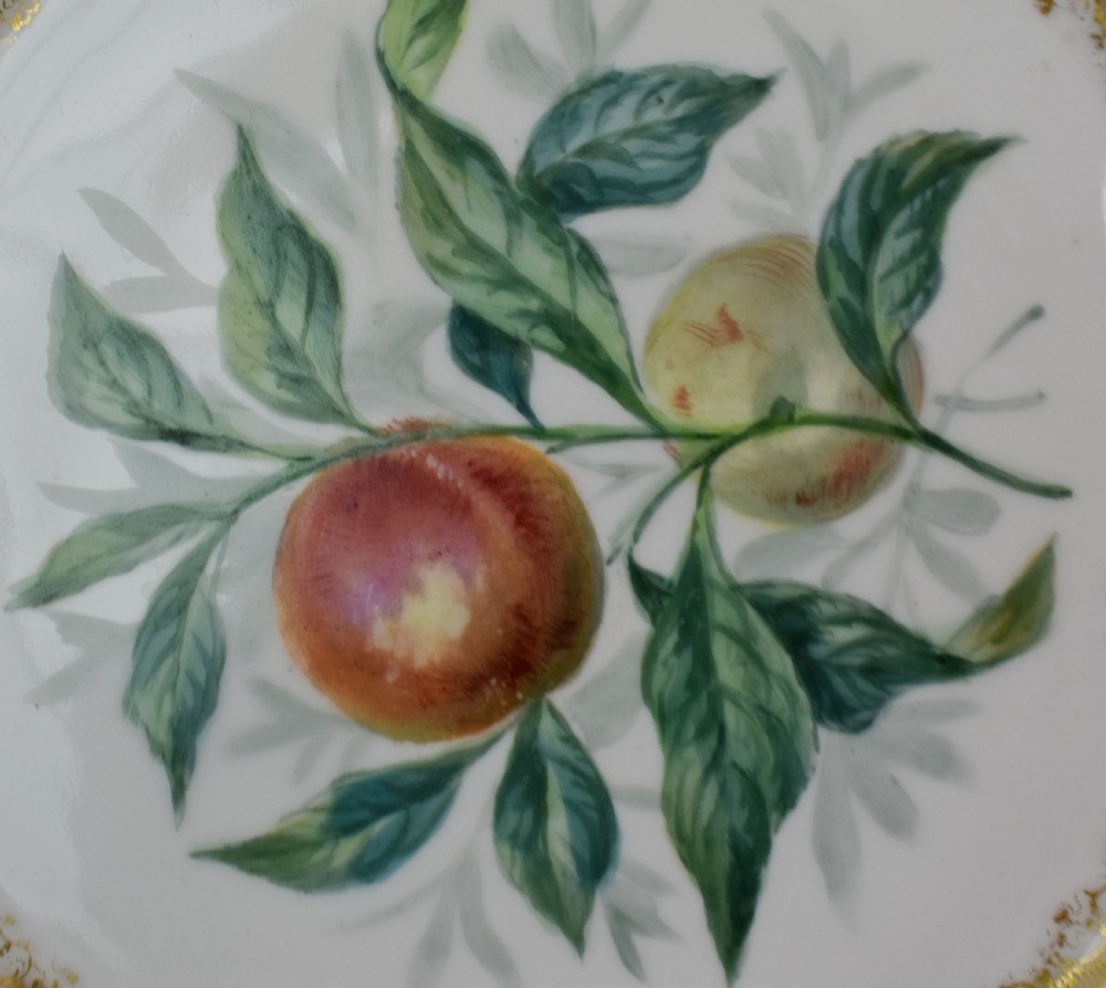 A set of four circular Russian porcelain plates decorated with hand-painted botanical fruit motifs, blush pink borders, and scalloped gilded rims. View IX