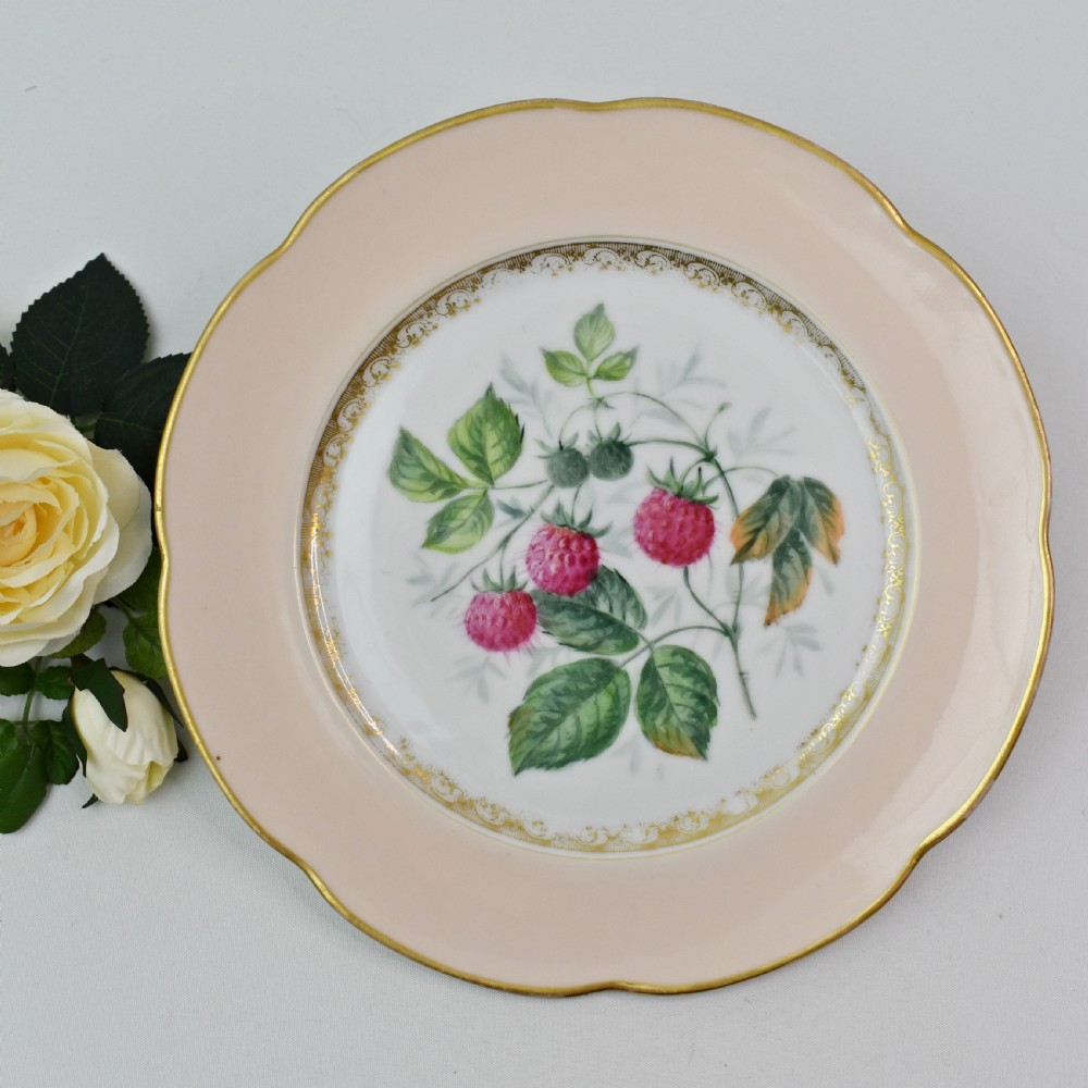 A set of four circular Russian porcelain plates decorated with hand-painted botanical fruit motifs, blush pink borders, and scalloped gilded rims. View XIII