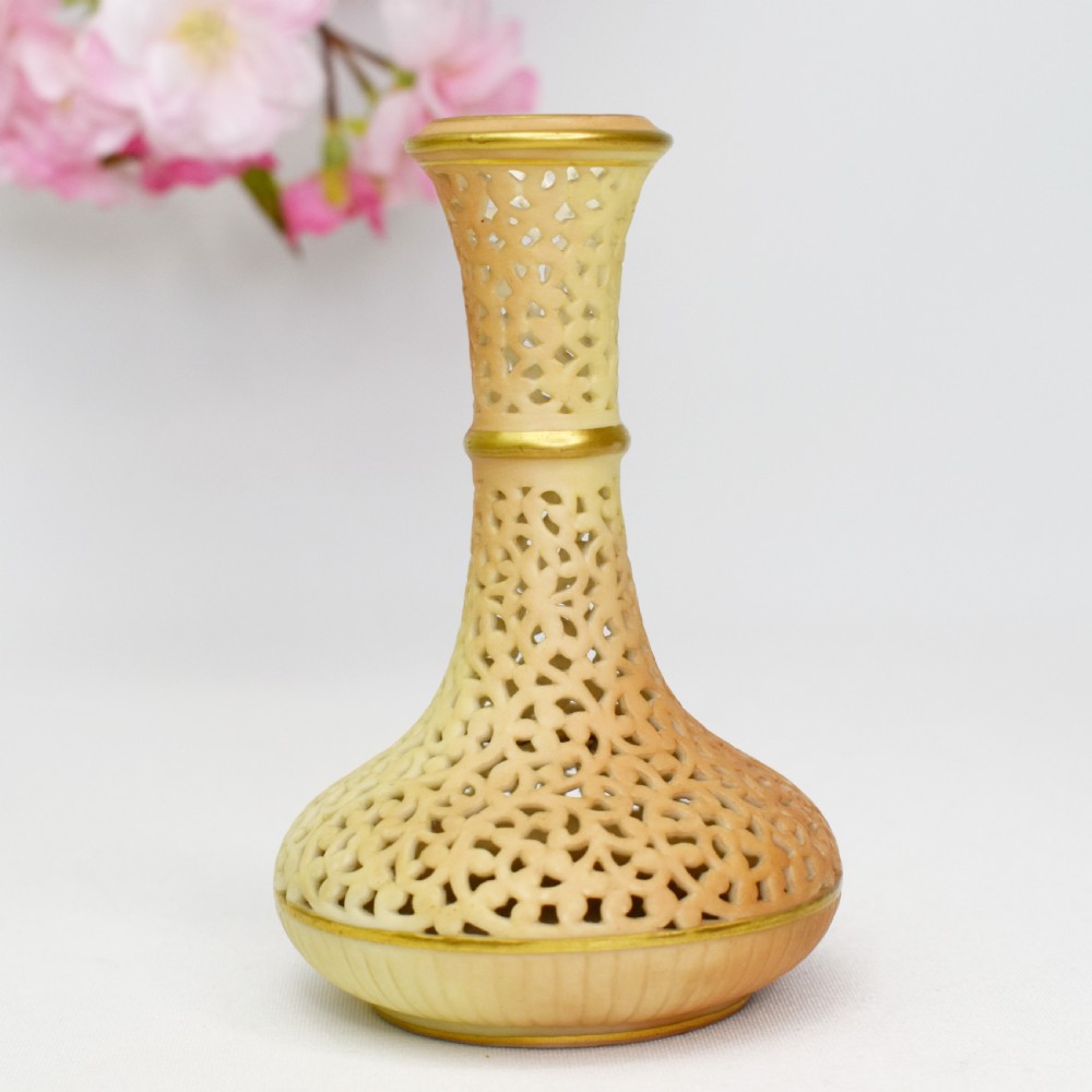 A Victorian Grainger Worcester reticulated porcelain bud vase with pierced openwork lattice decoration and gilded accents. View II