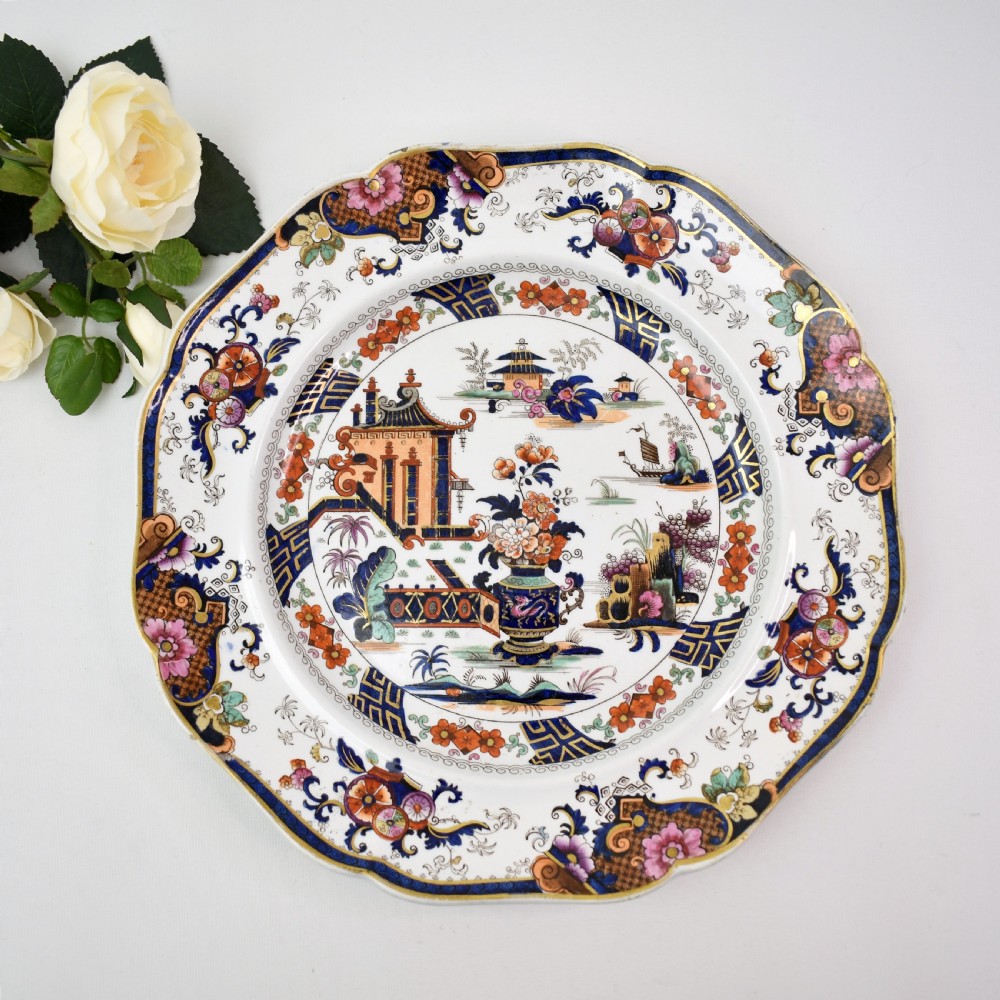 An octagonal Victorian stoneware plate by John Ridgway featuring an intricate Penang pattern with Chinoiserie pagodas, floral urns, cobalt blue borders, and gilded accents. View II