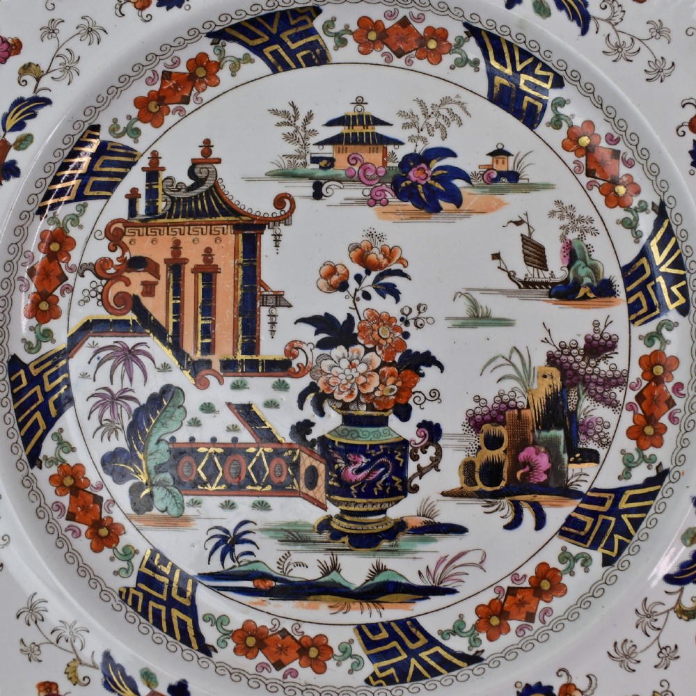 An octagonal Victorian stoneware plate by John Ridgway featuring an intricate Penang pattern with Chinoiserie pagodas, floral urns, cobalt blue borders, and gilded accents. View III