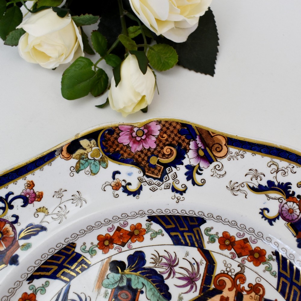 An octagonal Victorian stoneware plate by John Ridgway featuring an intricate Penang pattern with Chinoiserie pagodas, floral urns, cobalt blue borders, and gilded accents. View IV