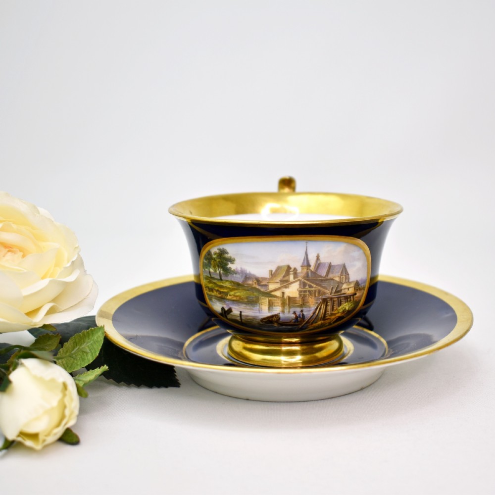 Fine 19th Century Meissen Cobalt and Burnished Gold Topographical Cup and Saucer, c.1830-40