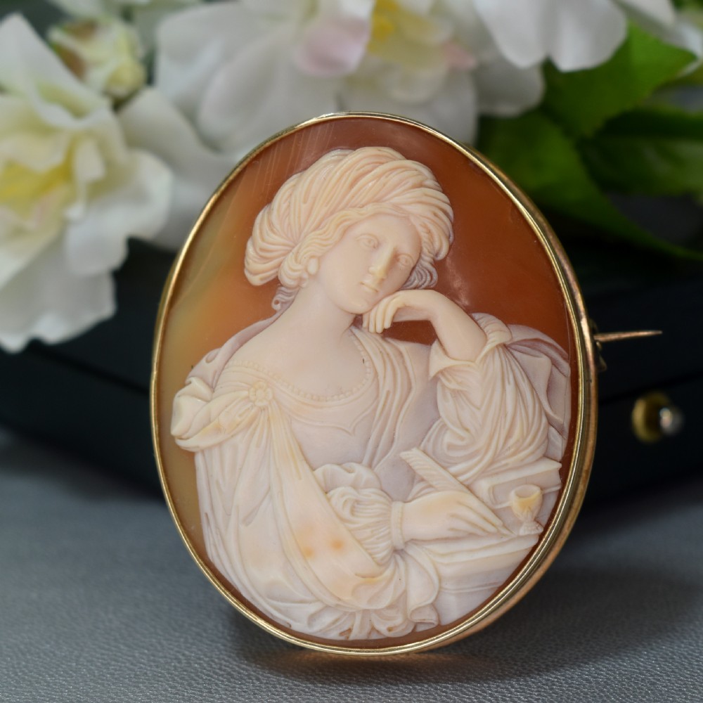 A mid-19th century oval shell cameo brooch set in a 9ct gold frame, depicting the Persian Sibyl after Guercino in relief.