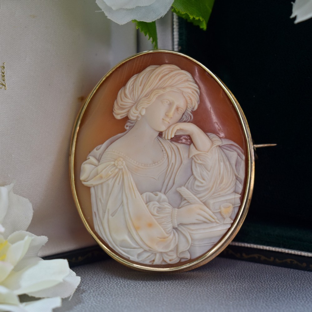 A mid-19th century oval shell cameo brooch set in a 9ct gold frame, depicting the Persian Sibyl after Guercino in relief. View IV