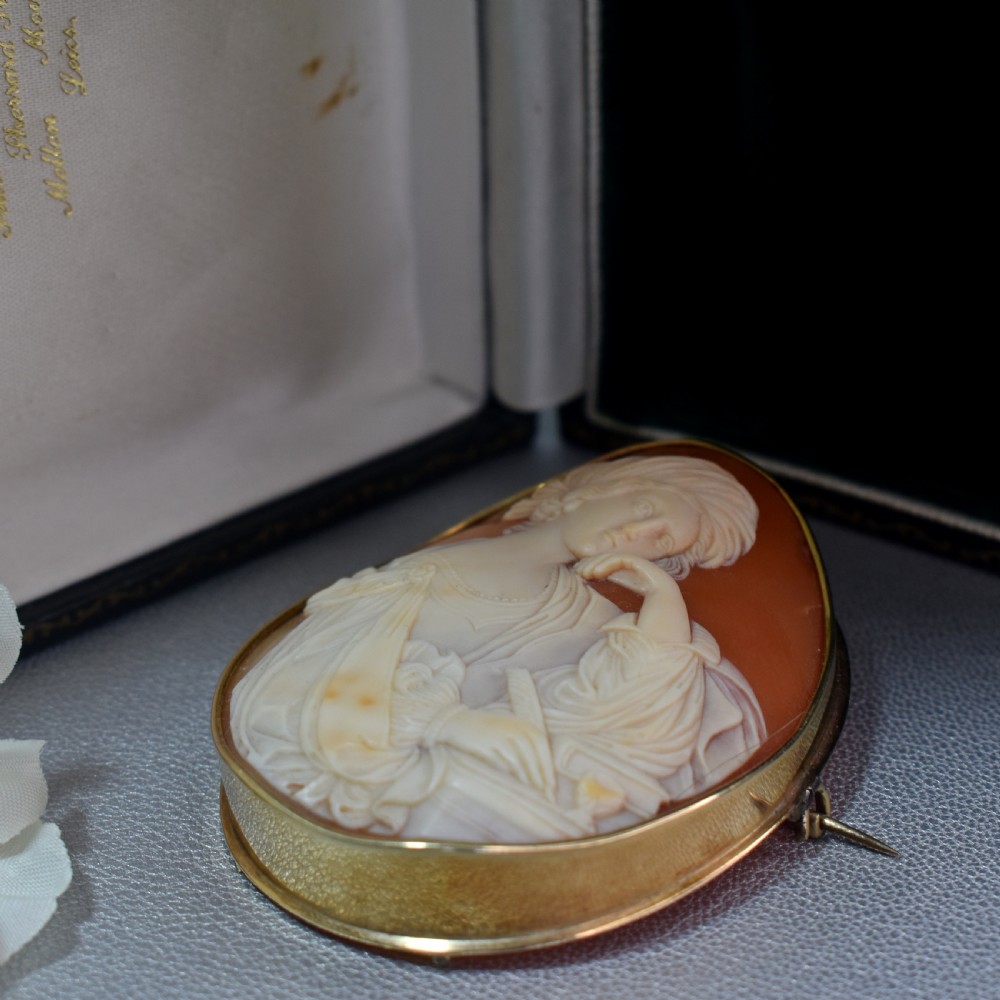 A mid-19th century oval shell cameo brooch set in a 9ct gold frame, depicting the Persian Sibyl after Guercino in relief. View V