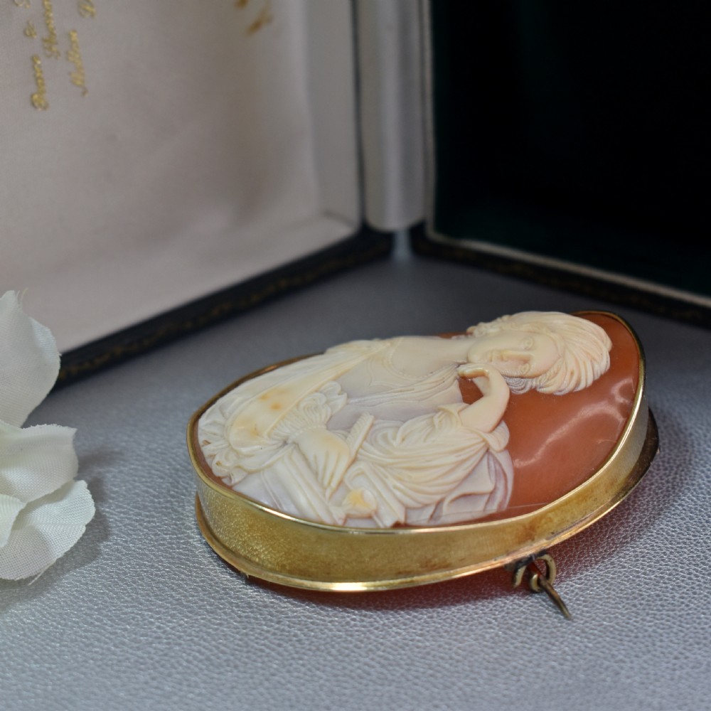 A mid-19th century oval shell cameo brooch set in a 9ct gold frame, depicting the Persian Sibyl after Guercino in relief. View VI