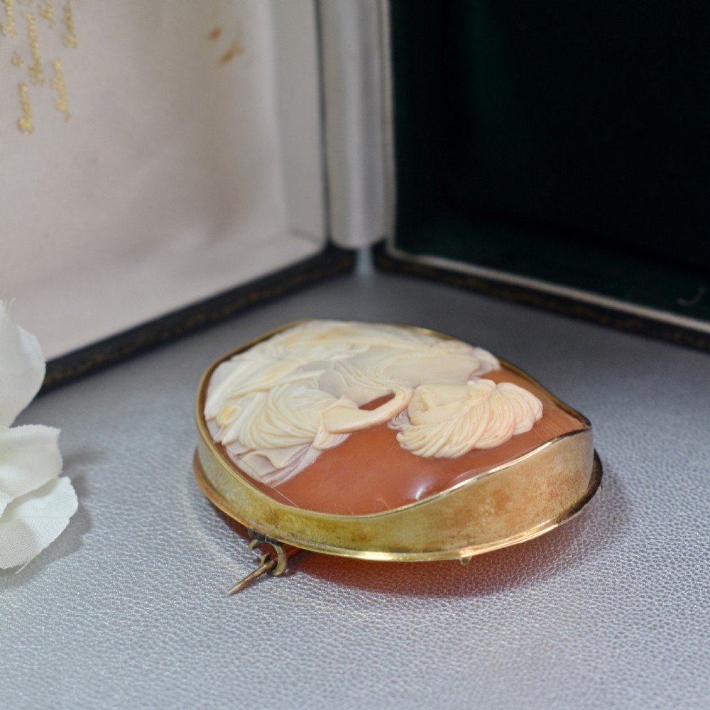 A mid-19th century oval shell cameo brooch set in a 9ct gold frame, depicting the Persian Sibyl after Guercino in relief. View VII