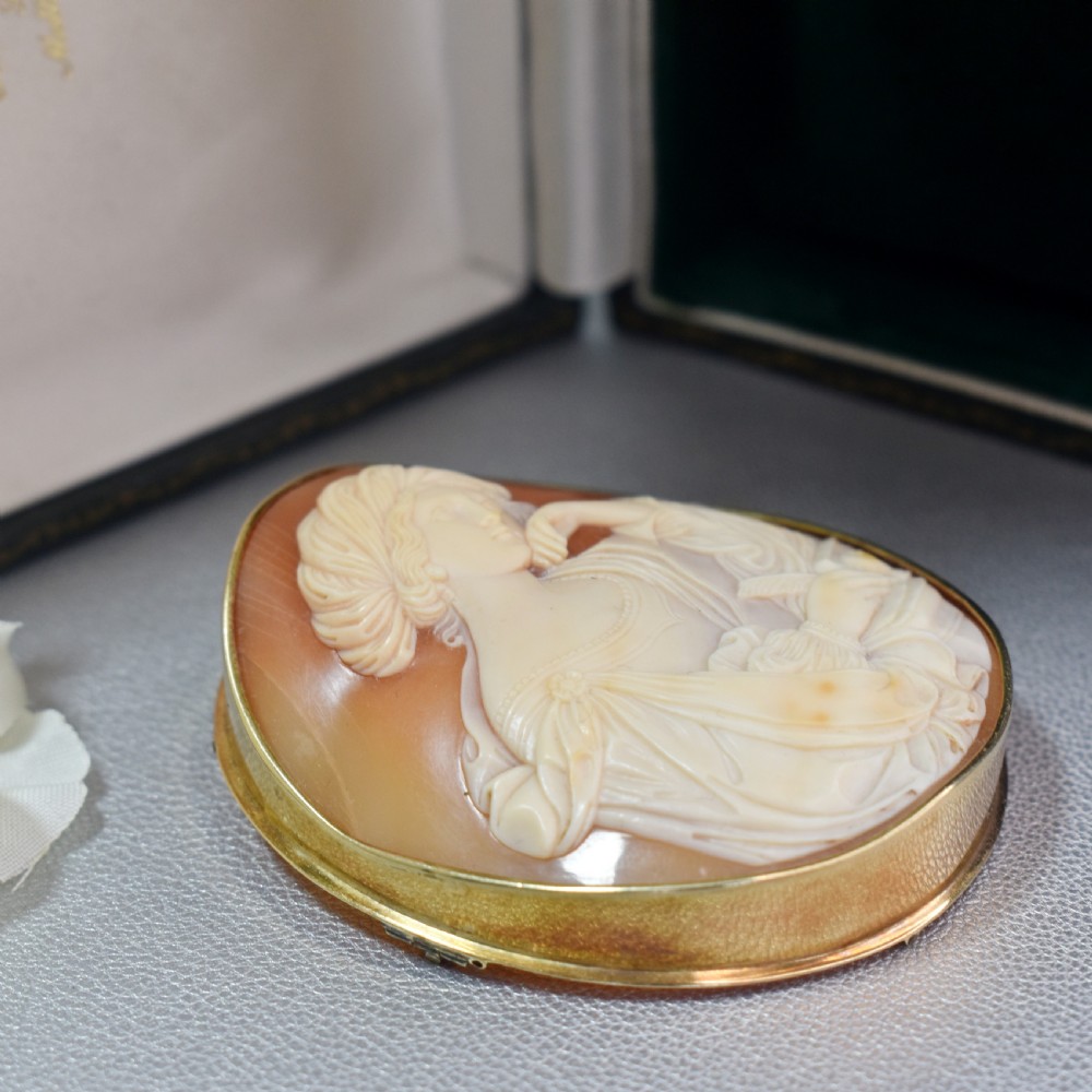 A mid-19th century oval shell cameo brooch set in a 9ct gold frame, depicting the Persian Sibyl after Guercino in relief. View VIII