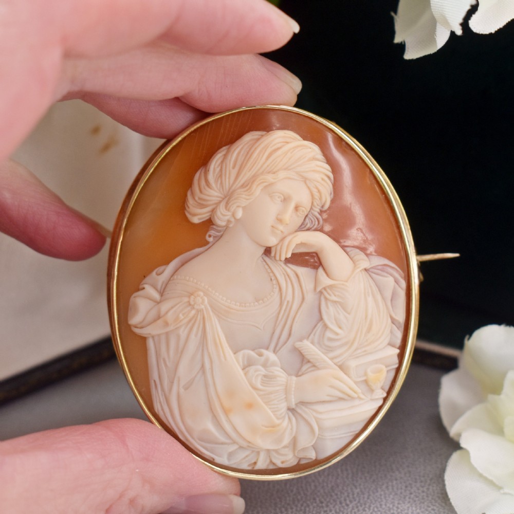 A mid-19th century oval shell cameo brooch set in a 9ct gold frame, depicting the Persian Sibyl after Guercino in relief. View IX