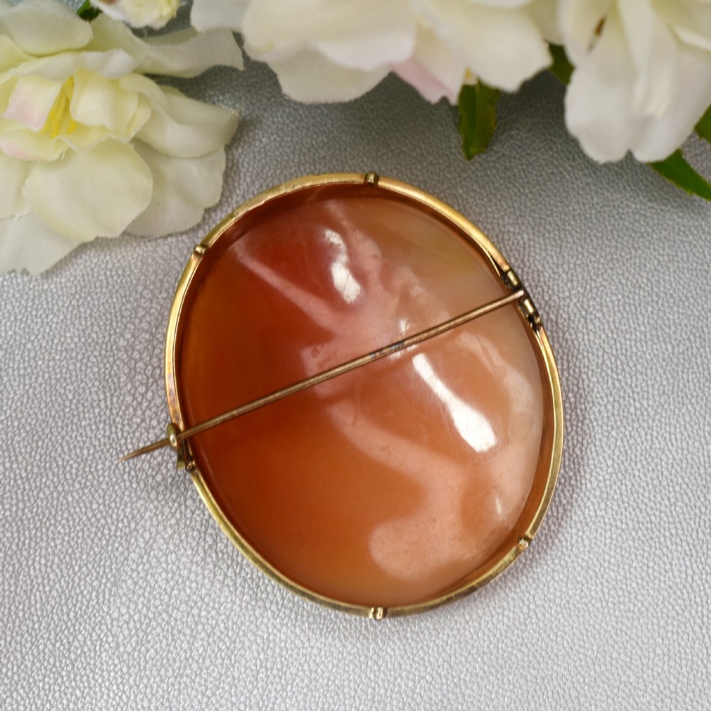 A mid-19th century oval shell cameo brooch set in a 9ct gold frame, depicting the Persian Sibyl after Guercino in relief. View XI