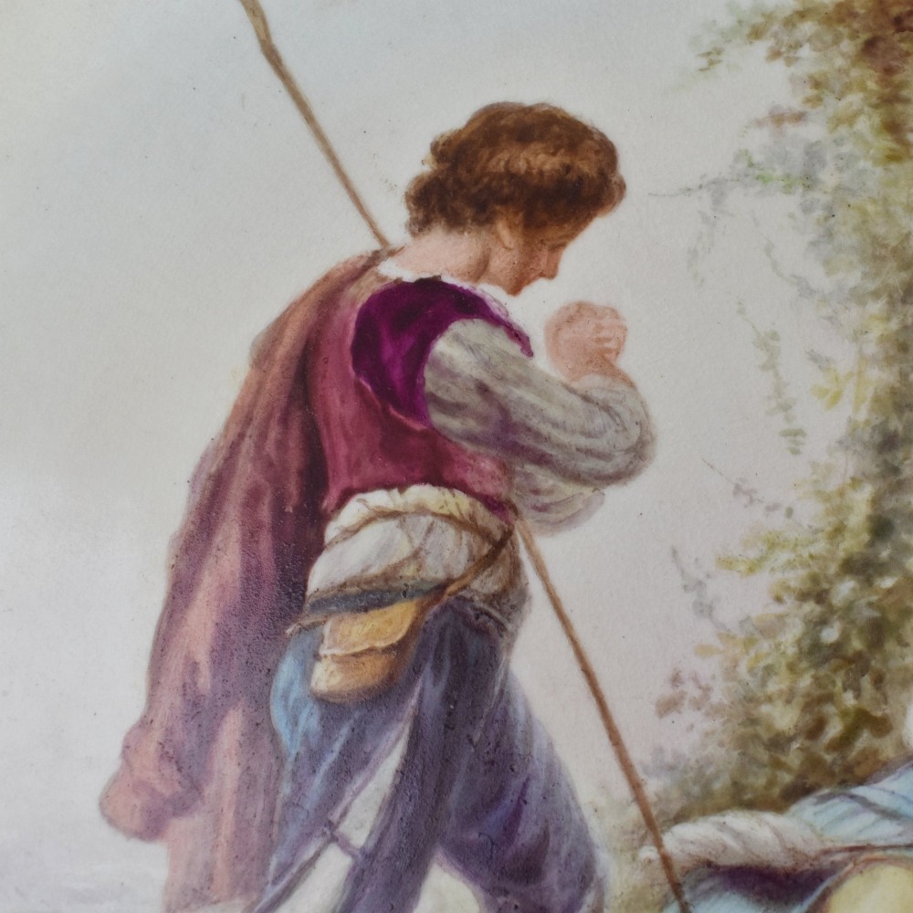 A circular Victorian porcelain cabinet plate featuring a hand-painted romantic pastoral scene enclosed by a lobed rim decorated with gold gilding. View V