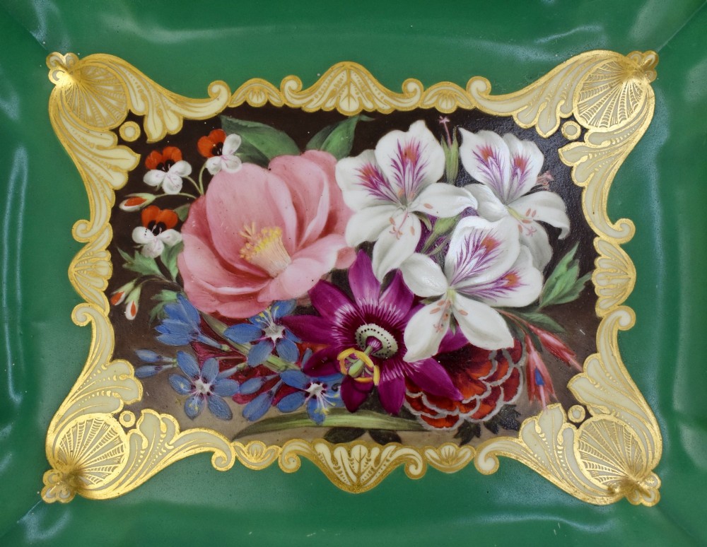 A rectangular green porcelain tray with elaborate gold scrollwork framing a hand-painted botanical bouquet in the centre. View II